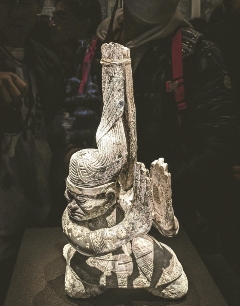 Bronze kneeling figure with twisted head from the late Shang Dynasty