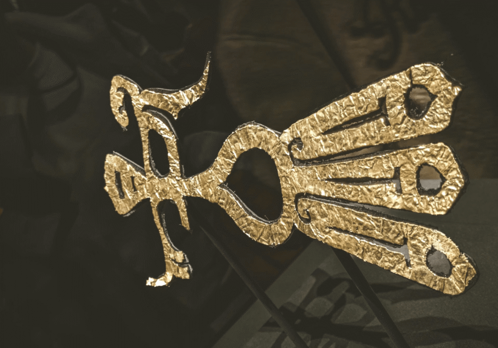 Golden bird-shaped ornament